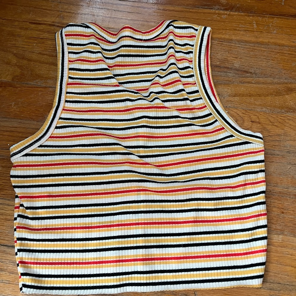Two tanks in one! One is white and the other is a colorful button up tanktop